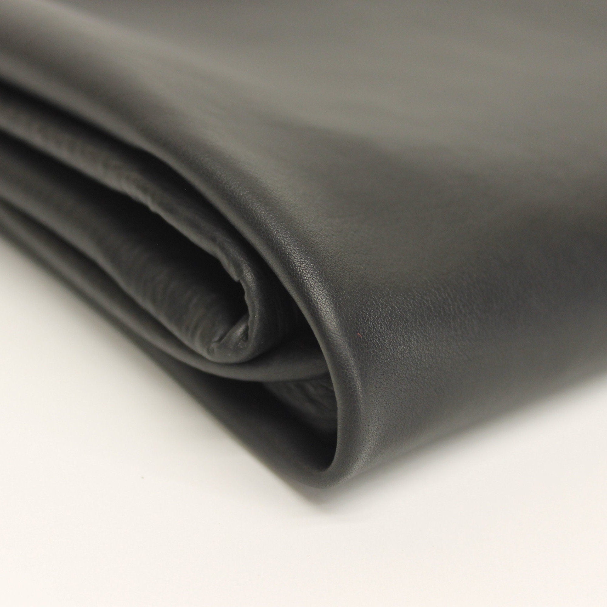 Thin Black leather | 0.6-0.8 mm | Soft, elastic | Calf hides skins | Bookbinding Sewing Purses Clothing